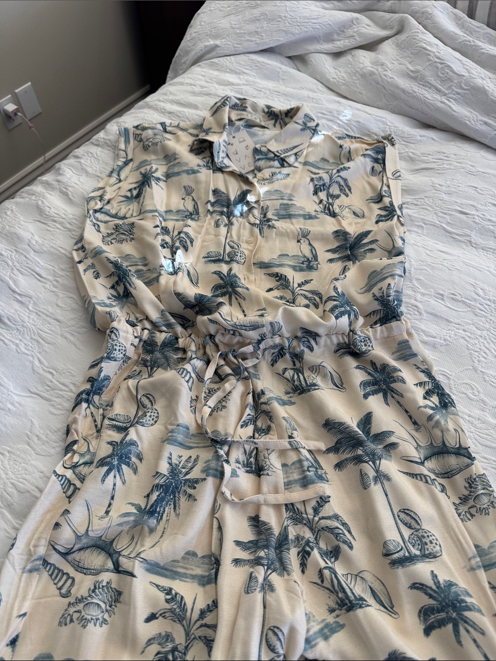 Sleeveless Cream Tropical Print jumpsuit with Drawstring Waist